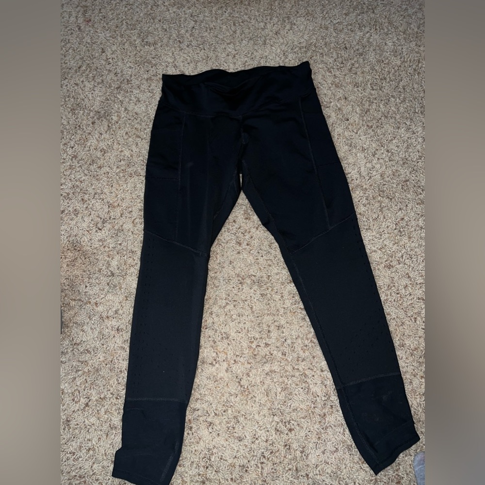 Black champion leggings with some holes on the bottom (how the pants were made)